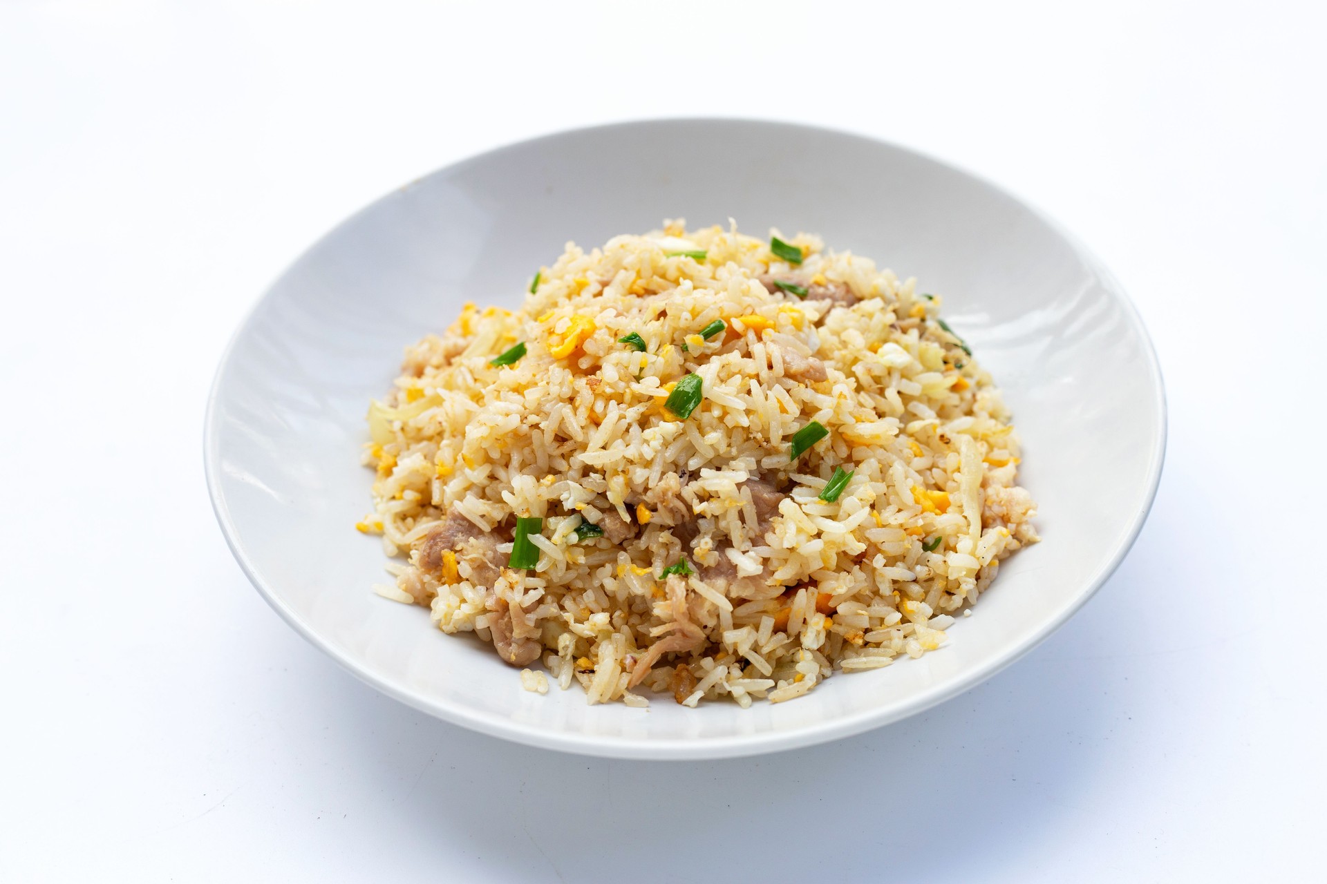 Fried rice in white plate on white background.